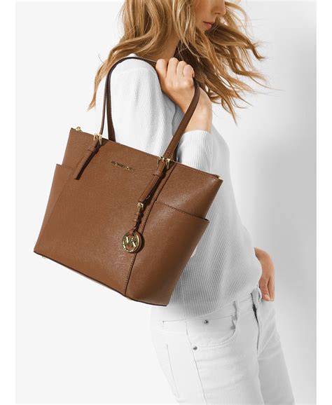 michael kors east west top zip tote luggage|Michael Kors logo jet set.